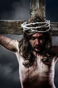 Jesus Christ with crown of thorns white on the cross of Calvary